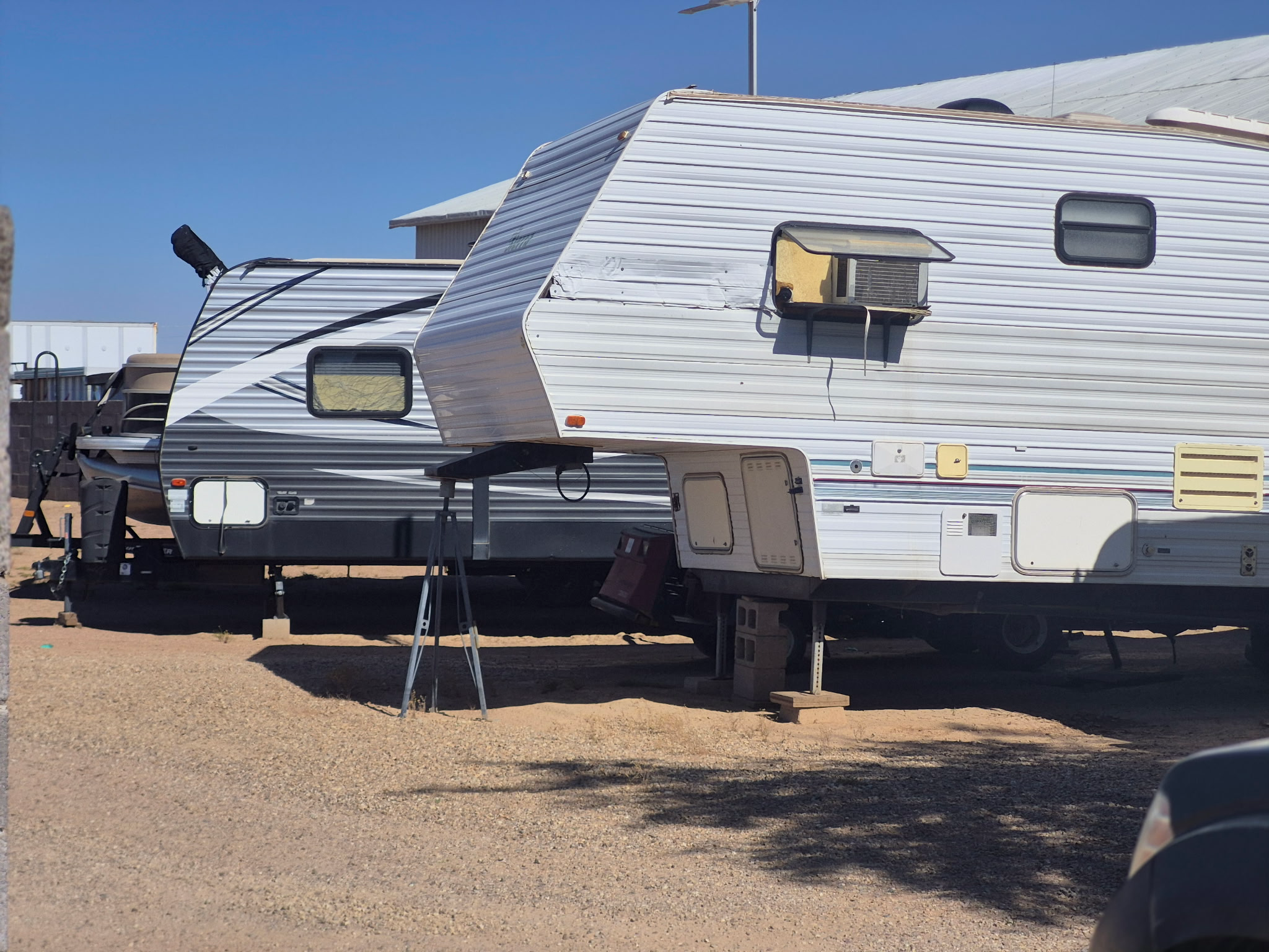 Fifth-wheel and travel trailers in the storage yard